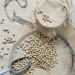Soybeans on wooden background